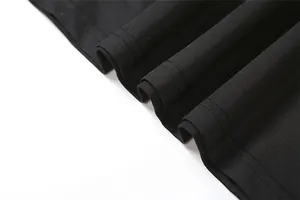 High-quality close-up detail of the hem and double-needle stitching on a black slim fit dress