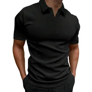 Detailed view of men's black short sleeve polo shirt featuring V-neck and ribbed vertical texture.