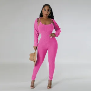 Vibrant fuchsia pink ribbed two-piece jumpsuit set featuring a sexy U-neck and matching bolero