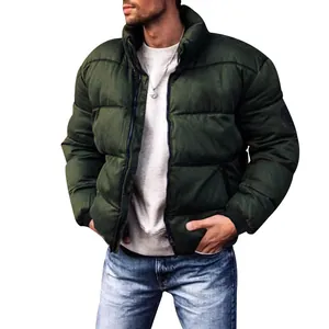 Close-up detail of men's dark green thick quilted puffer jacket with a stand collar