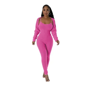 Detailed view of women's hot pink ribbed knit two-piece jumpsuit and shrug set
