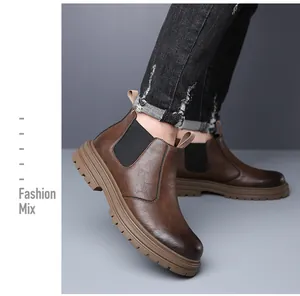 Detailed side view of men's brown leather Chelsea boots featuring a thick lug sole