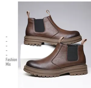 Detail of brown leather Chelsea boots with elastic side panels and thick rubber soles