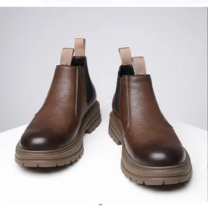 Detail view of brown leather Chelsea boots featuring a thick anti-slip rubber sole