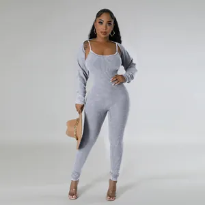 Full-length view of a stylish grey ribbed knit jumpsuit with a matching cropped shrug set
