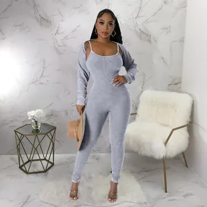Front view of a sexy grey U-neck ribbed jumpsuit and matching long sleeve shrug set.