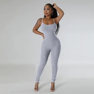Detailed view of grey ribbed U-neck sleeveless jumpsuit showing slim fit and fabric texture.