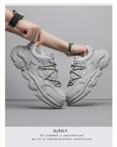 Grey leather men's chunky sneakers with thick wavy sole shown in professional detail