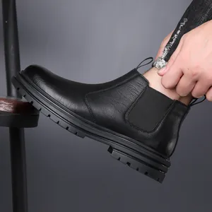 Classic black leather men's Chelsea boots with thick lug sole and elastic side panel