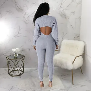 Back view of a sexy grey ribbed jumpsuit set with unique cutout detail and crop top