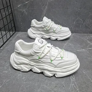 Close-up of white platform chunky sneakers with thick rope laces and textured sole