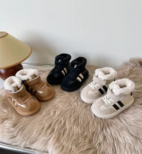 Group of warm toddler winter snow boots in three colors with soft faux fur lining.