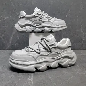 Side profile of chunky off-white leather sneakers with thick wavy soles and rope laces