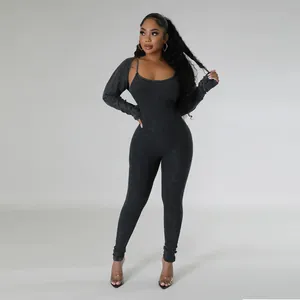 Black ribbed u-neck jumpsuit set with matching long sleeve bolero shrug