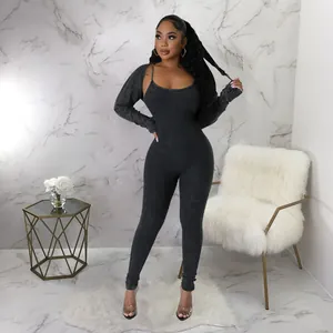 Slim fit two-piece black ribbed jumpsuit set with u-neck bodysuit and cropped shrug