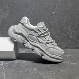 Close-up of premium grey leather chunky sneaker with platform dissolving sole design