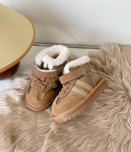 Close-up detail of toddlers' warm winter snow boots with plush lining and stripes