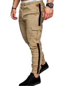 Detailed view of khaki cargo pants with black side stripes and drawstring waist.