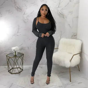 Sexy charcoal grey ribbed two-piece set featuring a U-neck jumpsuit and matching long sleeve shrug