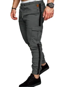 Detailed side view of grey men's cargo joggers with black stripes and side pockets.