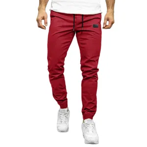 Professional men's solid red casual joggers featuring drawstring waist and elastic cuffs