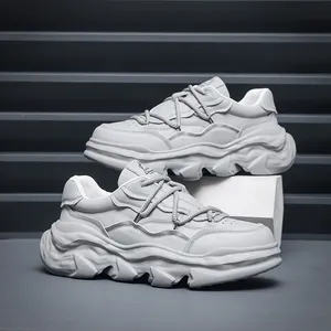 Minimalist grey chunky sneakers for men featuring a unique dissolving platform sole design