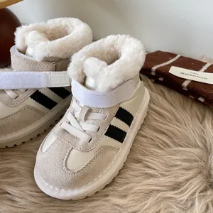 Cozy beige children's snow boots with plush faux fur lining and black sporty stripes
