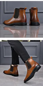 Side view showing the sleek brown leather finish and elastic panels of Chelsea boots