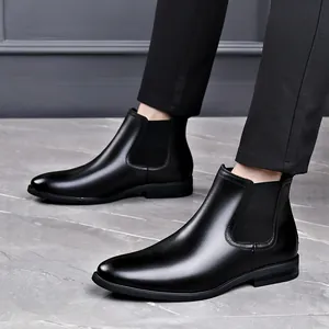 Premium men's black leather Chelsea boots featuring a pointed toe and elastic panels