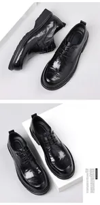 Detail view of premium black leather business casual dress shoes with thick soles.