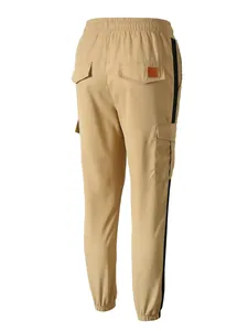 Detail back view of men's khaki cargo pants with black side stripes and pockets