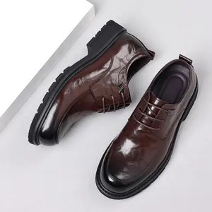 Men's brown leather business casual dress shoes with thick soles and lace-up design