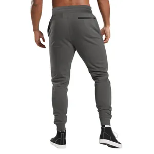 Detailed back view of men's dark grey jogger sweatpants featuring a secure zip pocket