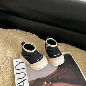 Cozy toddler snow boots featuring warm plush lining and side zipper in black and beige