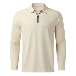 Detailed view of beige waffle knit long sleeve polo shirt featuring a black quarter zip