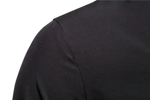 Detailed close-up of a black men's shirt shoulder seam and high-quality fabric texture