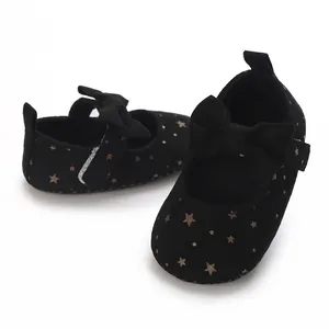 Soft-sole black baby Mary Jane princess shoes with gold stars and decorative bow