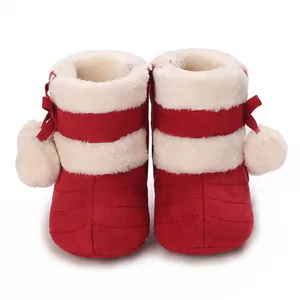 Warm red and white striped infant winter boots with thick plush lining and side poms