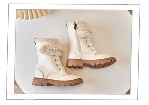 Cozy cream-colored children's Martin boots featuring soft faux wool trim and metal chain