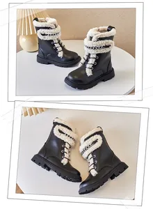 Detailed views of children's warm Martin boots with faux fur lining and silver chains.