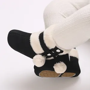 Close-up of warm baby winter boots with faux fur trim and non-slip honeycomb sole