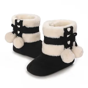 Cozy baby winter pre-walker boots with faux fur lining and pom-poms, black and white