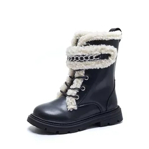 Stylish black children's Martin boots featuring warm cream fleece lining and silver chain detail