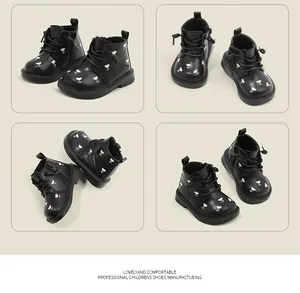Multi-angle view of black leather toddler boots with delicate floral embroidery.