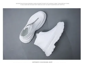 Detailed top view of modern men's white platform leather boots with front zipper