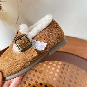 Cozy brown suede kids winter Birkenstock style shoes with warm white fleece lining and buckle