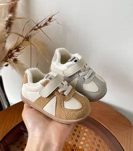 Warm fleece-lined toddler walking shoes with hook-and-loop closure in tan and grey colors.