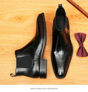 Botas Chelsea clásicas de cuero negro para hombre con elegantes detalles grabados