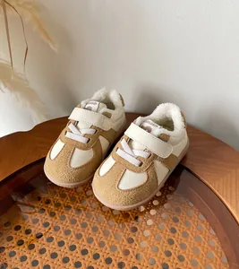 Close-up of warm faux fur lining and velcro straps on baby winter walking shoes