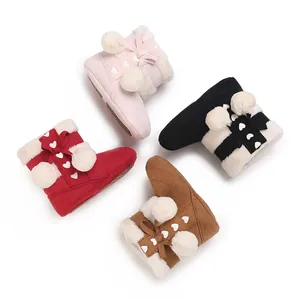 Selection of warm infant winter boots in four colors with cute pom-poms and fur lining